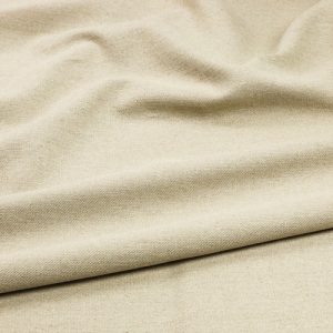 Close-up of a beige fabric in soft, natural folds.