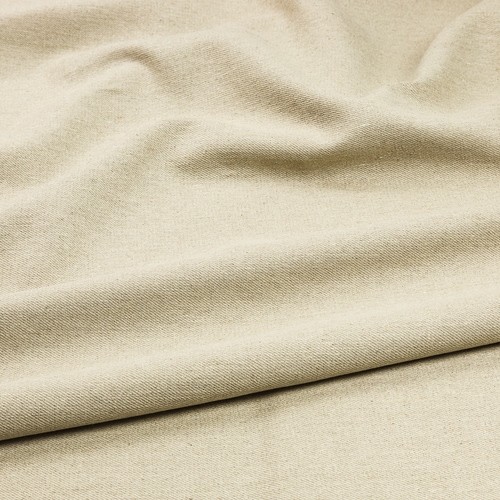 Close-up of a beige fabric in soft, natural folds.